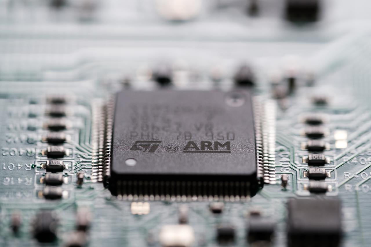 ARM company logo seen on microchip wich is soldered on a Printed Circuit Board (PCB) in London, United Kingdom, September 17, 2023. (Adobe Stock Photo)