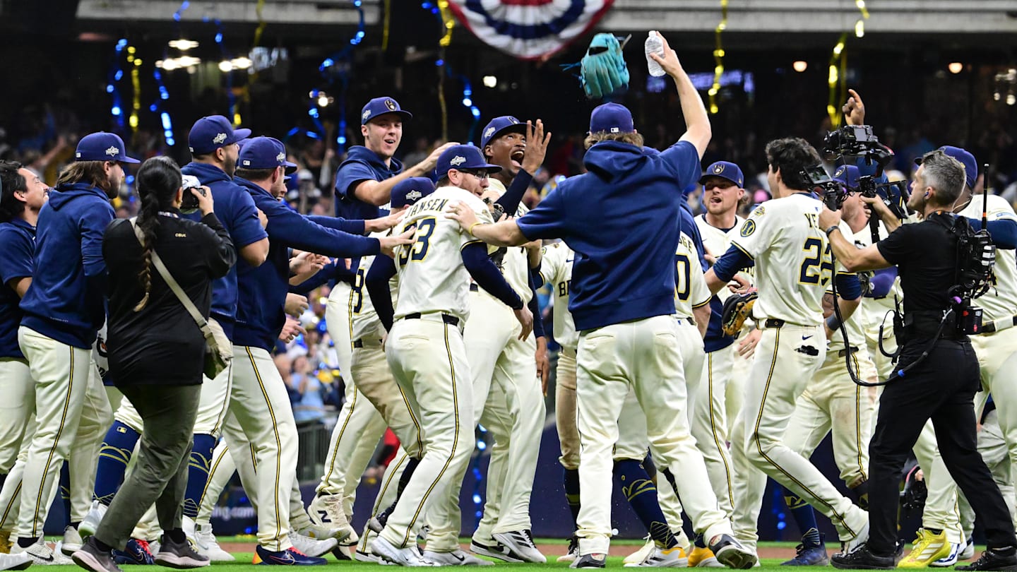 Oct 11, 2025; Milwaukee, Wisconsin, USA; Milwaukee Brewers pitcher Abner Uribe (45) celebrates with teammates after defeating the Chicago Cubs during game five of the NLDS round for the 2025 MLB playoffs at American Family Field. Mandatory Credit: Benny Sieu-Imagn Images