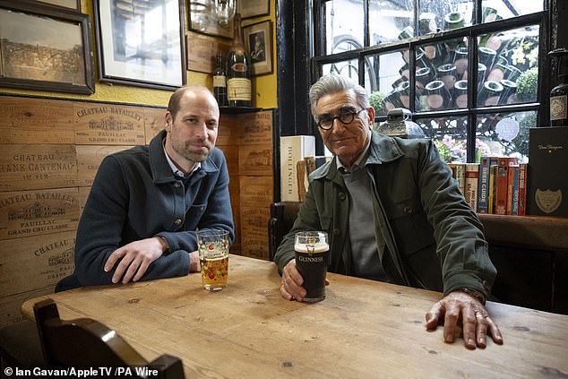 Prince William and Eugene Levy have a drink in a pub during the actor's new Apple TV+ series