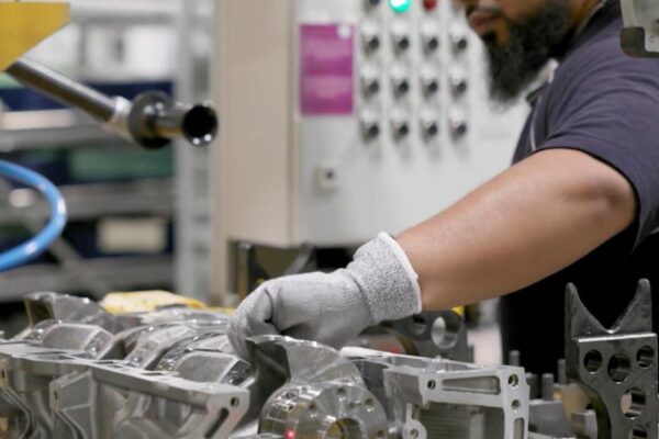UK business activity improves as manufacturing returns to growth