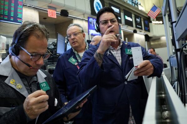 Stocks rally and Dow closes above 47,000 for first time after cooler-than-expected inflation report