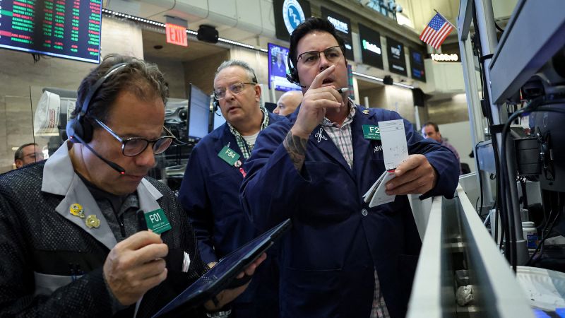 Stocks rally and Dow closes above 47,000 for first time after cooler-than-expected inflation report