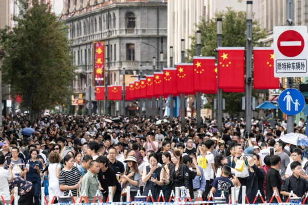 Pedestrians in the Nanjing Road shopping area during the Golden Week holiday in Shanghai, China, on  Oct. 2, 2025.