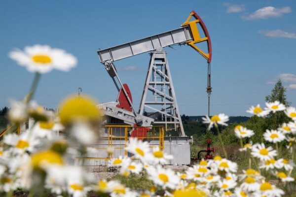 Oil drops as investors weigh a supply surplus outlook and US-China trade tensions