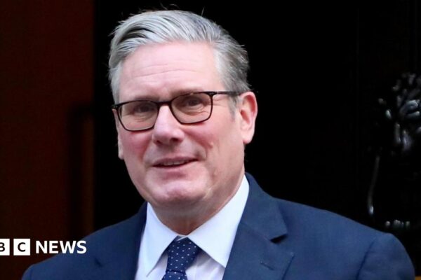 Keir Starmer in a navy suit.