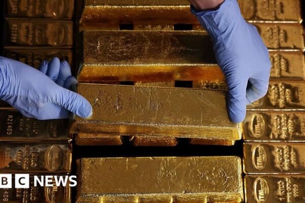 Gold surges past record $4,000 an ounce as uncertainty fuels rally