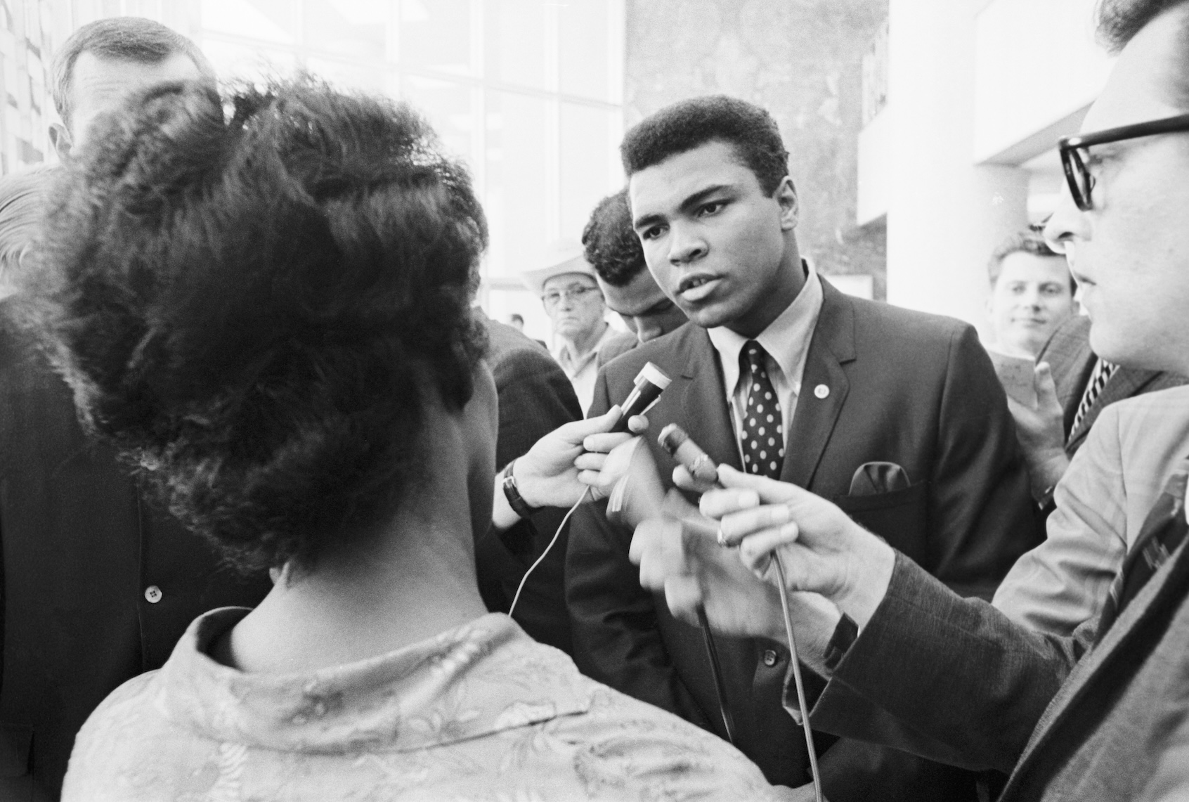 Muhammad Ali speaking with reporters after his 1967 federal indictment for refusing to be inducted into the U.S. armed forces. (Bettmann via Getty Images)