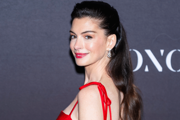 Anne Hathaway was spotted in NYC wearing light-wash jeans, a bright red blazer, and fuchsia pumps, a most interesting color combination