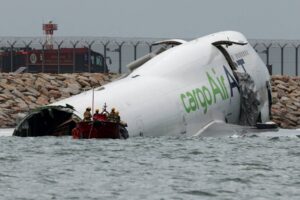 Two people dead after cargo plane skids off Hong Kong runway
