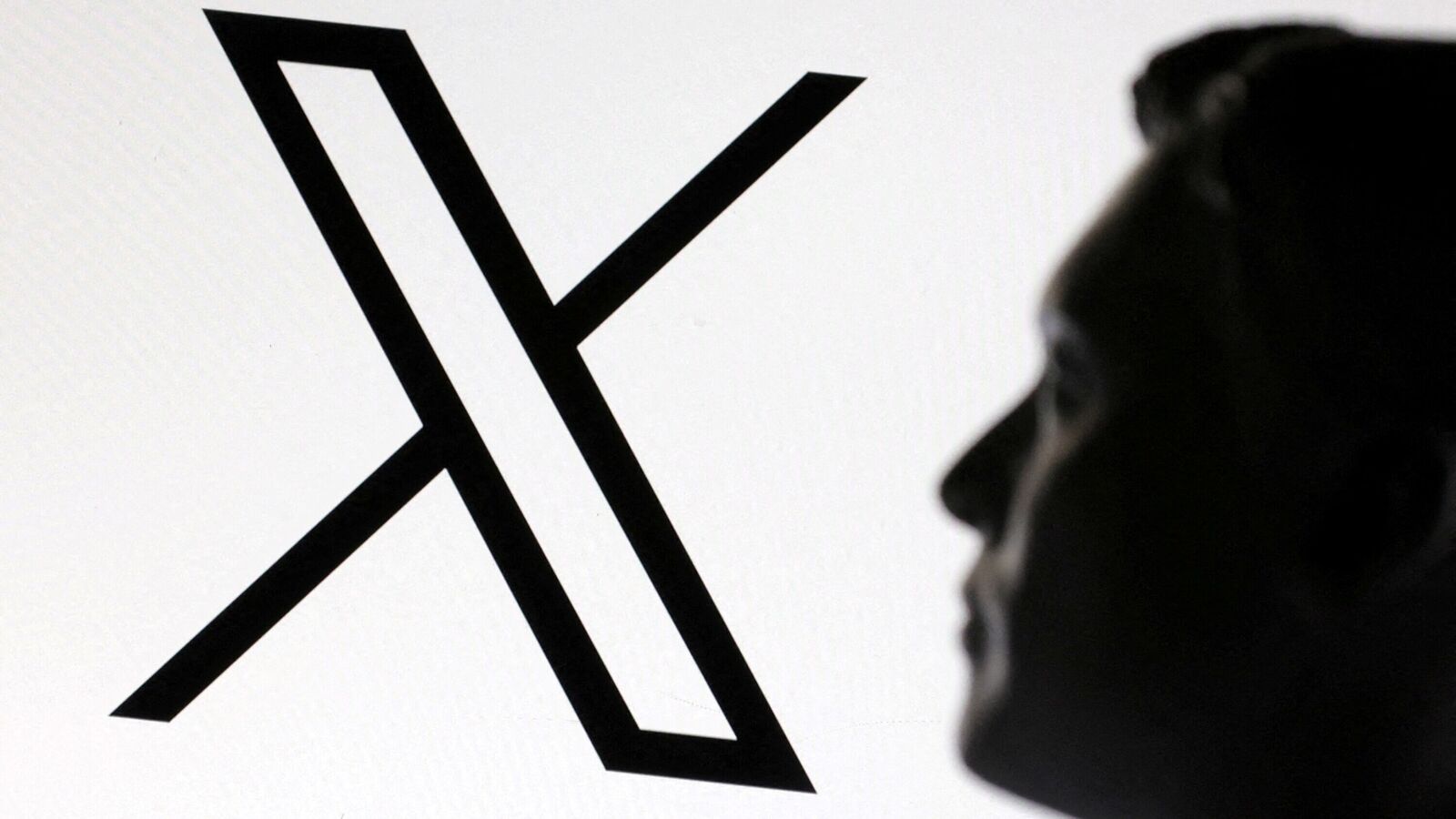 A 3D-printed miniature model of Elon Musk and the X logo are seen in this illustration.