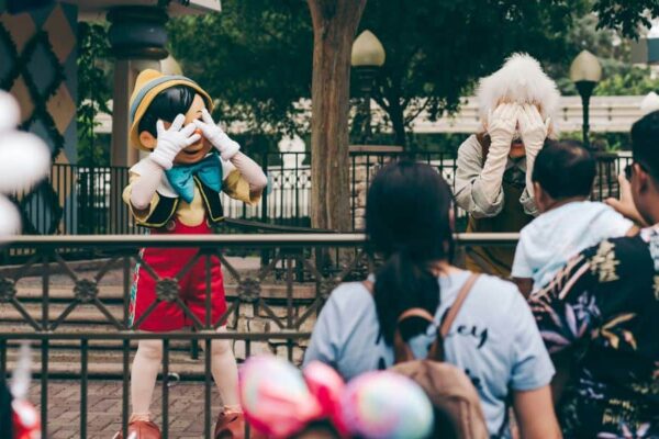 Pinocchio and Gepetto hide their faces at Hong Kong Disneyland