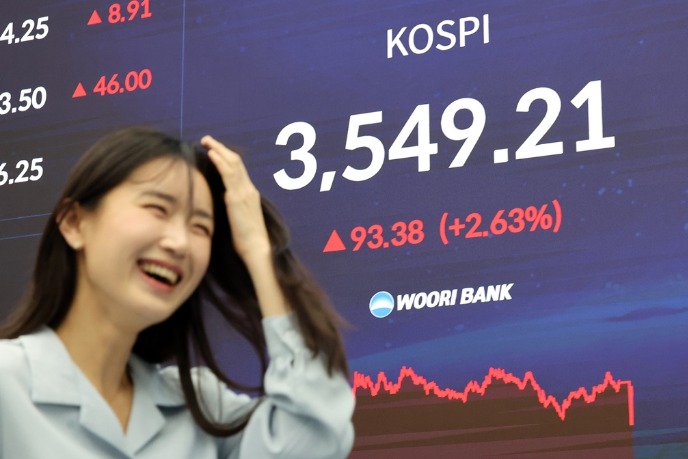 Korea Exchange to cut trading fees for 1st time in two decades as Kospi hits record high past 3,500