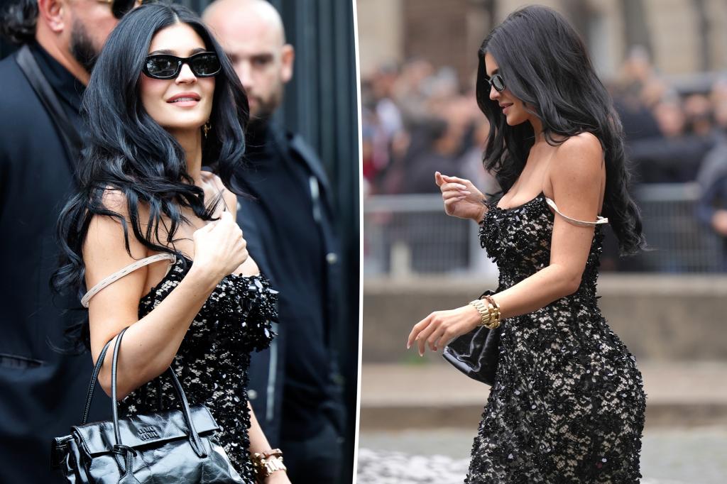 Kylie Jenner shows off her bra strap in sheer lace Miu Miu dress during Paris Fashion Week