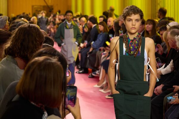 a model on the Miu Miu Spring 2026 runway wearing an apron