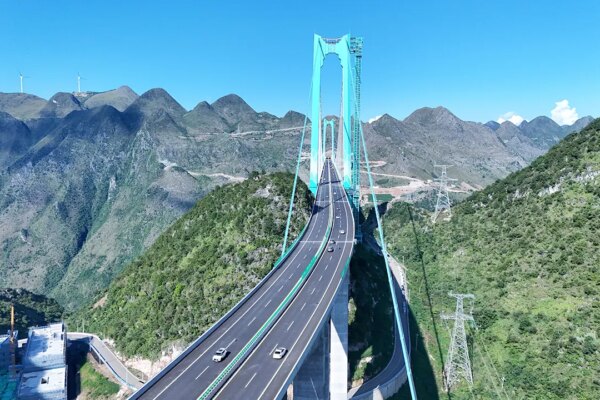 China opens world's reported largest span bridge over Beipan River valley to traffic