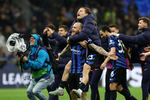 MILAN, ITALY - APRIL 16: Nicolo Barella of FC Internazionale celebrates with teammate Federico Dimarco following their victory at the end of the UEFA Champions League 2024/25 Quarter Final Second Leg match between FC Internazionale Milano and FC Bayern München at San Siro on April 16, 2025 in Milan, Italy. (Photo by Marco Luzzani/Getty Images)