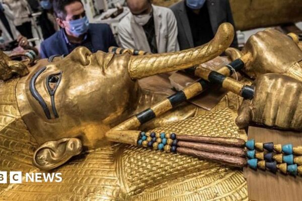 A close up of the face of the Golden Sarcophagus of Tutankhamun.
