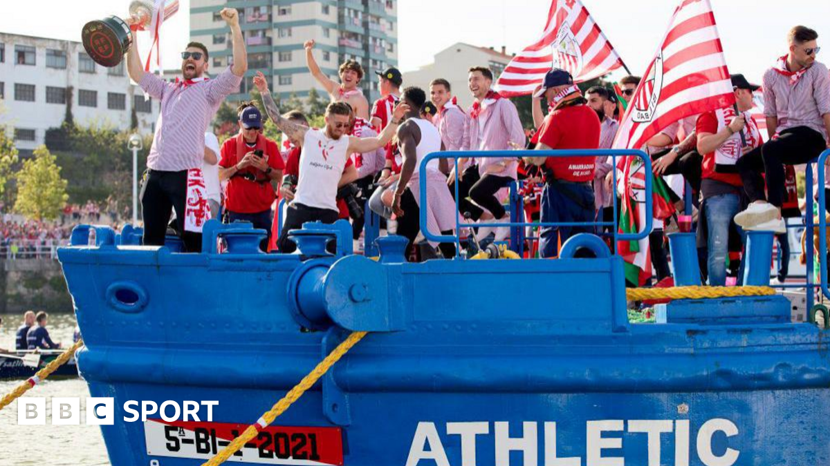 Athletic players celebrate on a barge