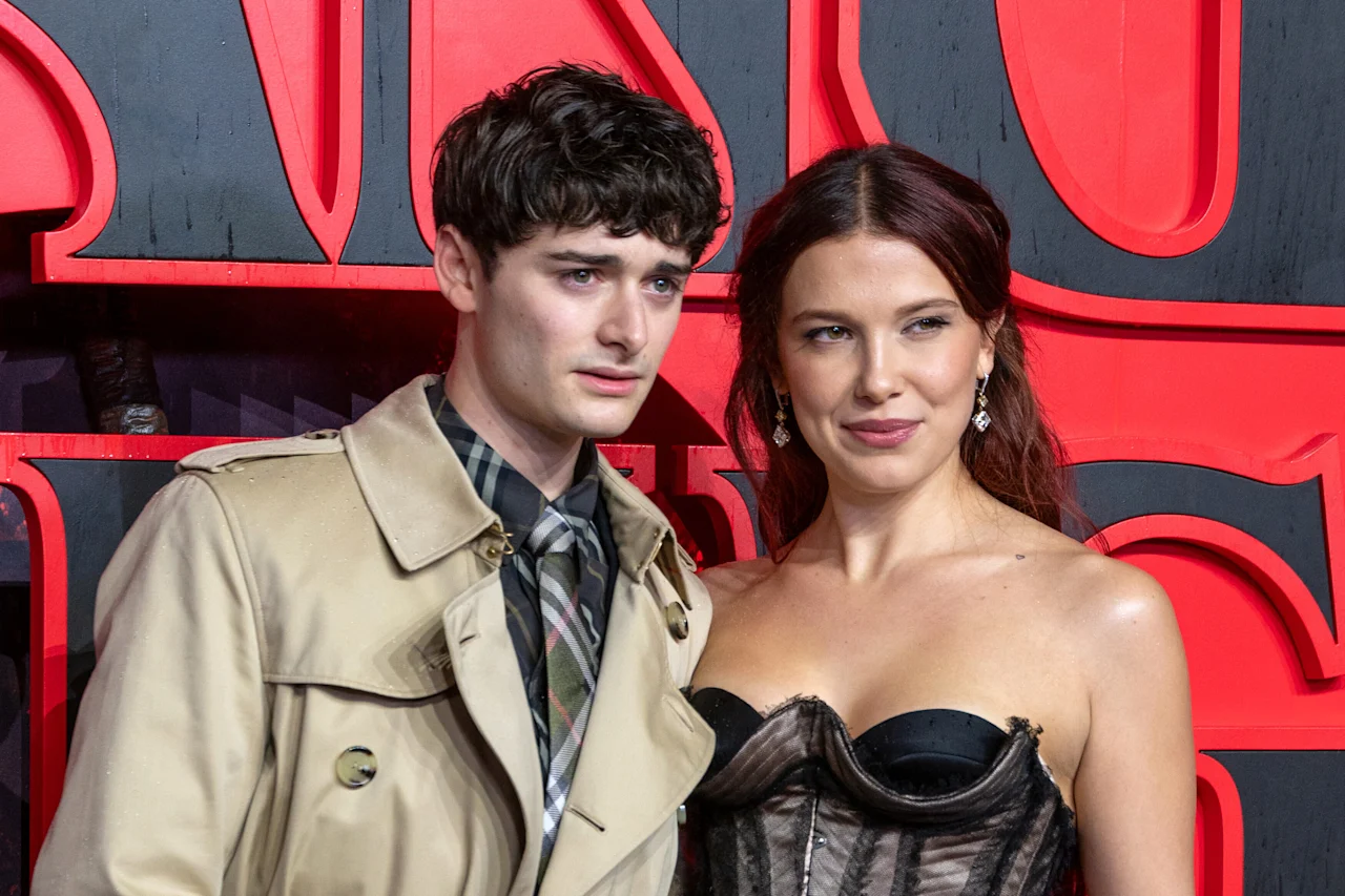 Photo by: James Warren/Famous/STAR MAX/IPx 2025 11/13/25 Noah Schnapp and Millie Bobby Brown attend the