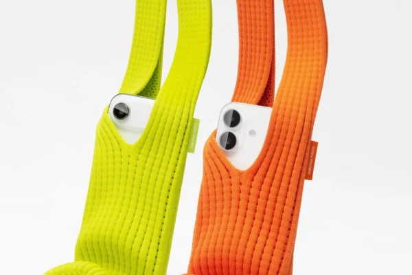 Apple and Japanese brand Issey Miyake launched the iPhone Pocket priced up to $230. The partnership builds on both brands’ design histories.