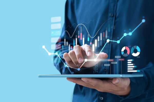 Businessman trading stock market on teblet screen by Nespix via iStock