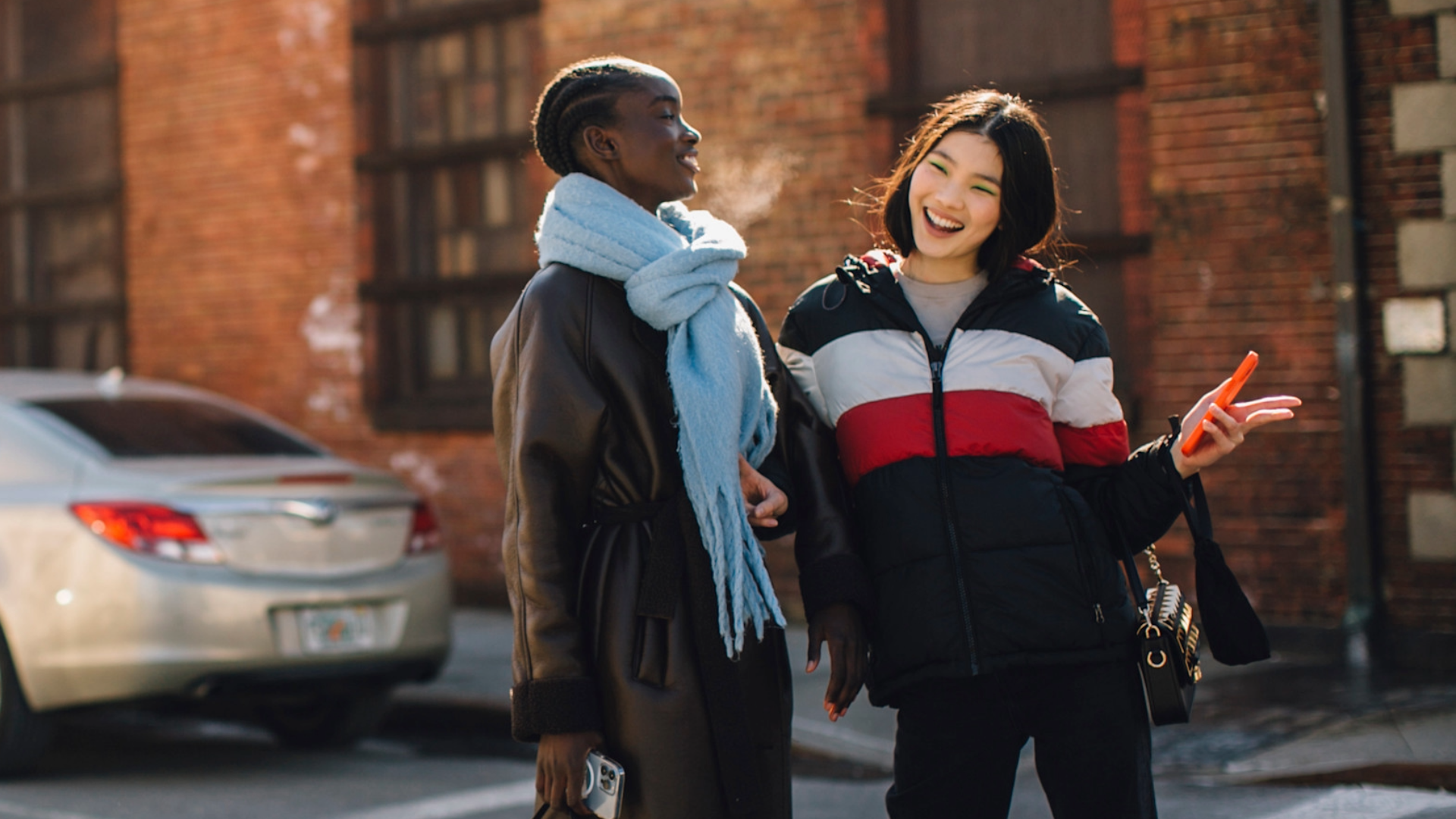 woen wearing jackets and scarves