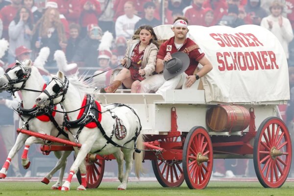 First Native woman drives Oklahoma's iconic Sooner Schooner, a covered wagon mascot