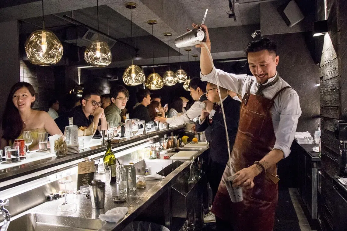 Mr Kit Cheung (right) co-founded Perfume Trees Gin, an internationally acclaimed spirit made with 13 botanicals.