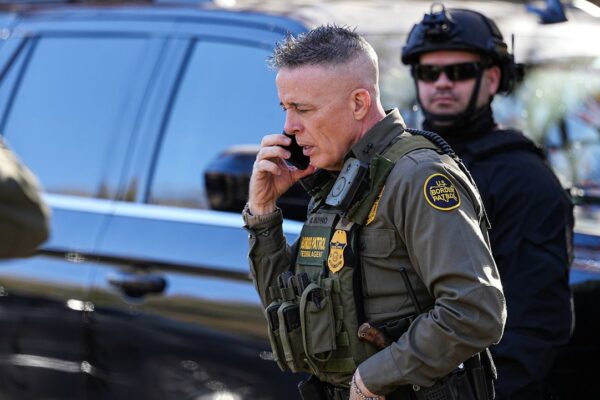 U.S. Border Patrol Commander Gregory Bovino takes a phone call Monday, Nov. 17, 2025, in Charlotte, N.C. (AP Photo/Matt Kelley)