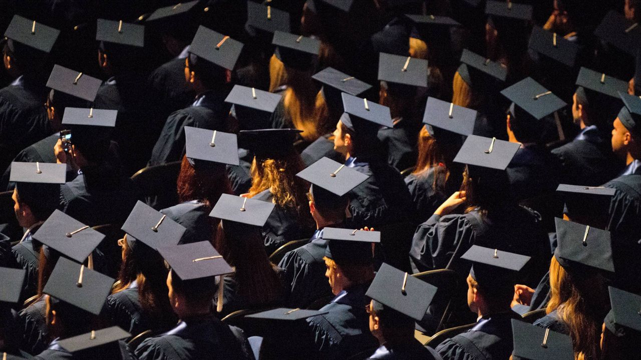 Students attend commencement ceremonies in the State Farm Center at the University of Illinois in Champaign, Ill., on Sunday, May 12, 2013. (Darrell Hoemann/The News-Gazette via AP, File)