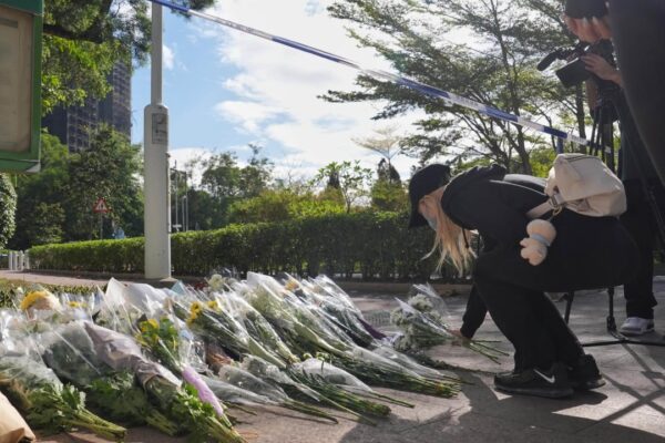 Hongkongers mourn fire victims at citywide condolence points; toll at 128