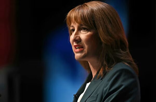 Rachel Reeves speaks at a podium, appearing serious, during the Labour party conference.