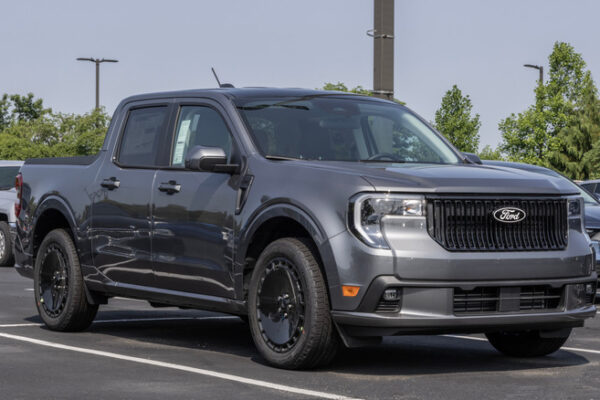 A gray Ford Maverick in a parking lot.
