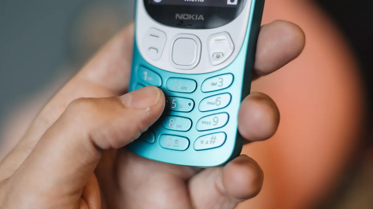 Nokia 3210 in hand