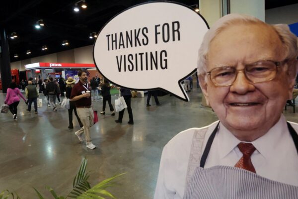 Buffett pictured in a sign at the annual shareholder meeting in May. Pic: Reuters