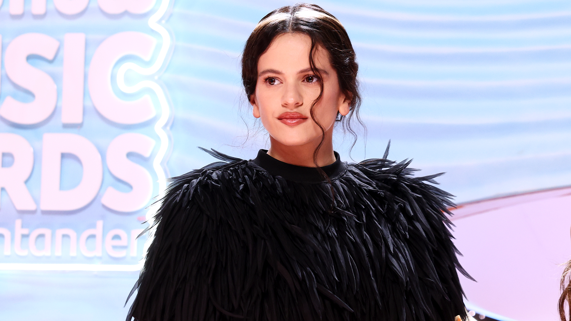 Rosalia attended the Los40 Music Awards in a feather-embellished skirt set from Balenciaga