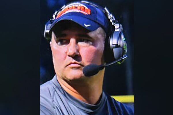 Missing Virginia football coach wanted on child sexual abuse material charges walked into woods with gun, family says