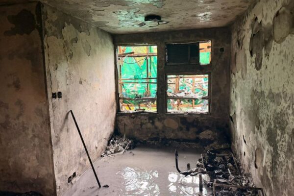 Hong Kong Police photos show the inside of burnt out apartments in Wang Fuk Court complex on Sunday November 30.