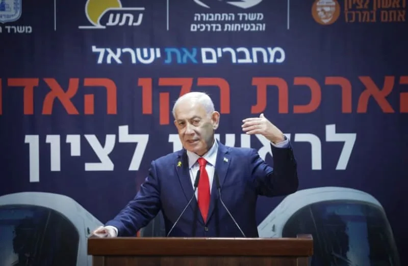 Prime Minister Benjamin Netanyahu speaks during a ceremony in Rishon LeZion ahead of the start of construction works for the Red Line of the light rail, which will extend to the city, December 25, 2025. (credit: Tal Gal/Flash90)