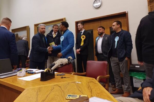 Owen Ferron, Reform UK candidate for the Long Eaton North division on Derbyshire County Council (centre, blue jacket), at Long Eaton Town Hall. Image from Eddie Bisknell. Free for use by all BBC wire partners.