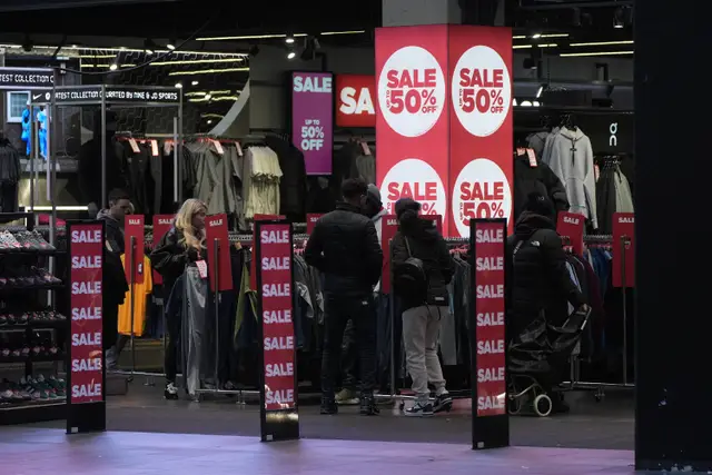 Shoppers in a branch of JD Sports in Liverpool during the Boxing Day sales