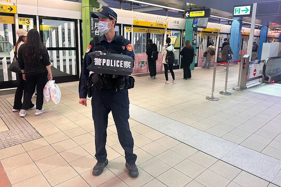 Taiwan National Police Agency/Anadolu via Getty  Police on standby after a stabbing attack in Taipei, Taiwan, on Dec. 20