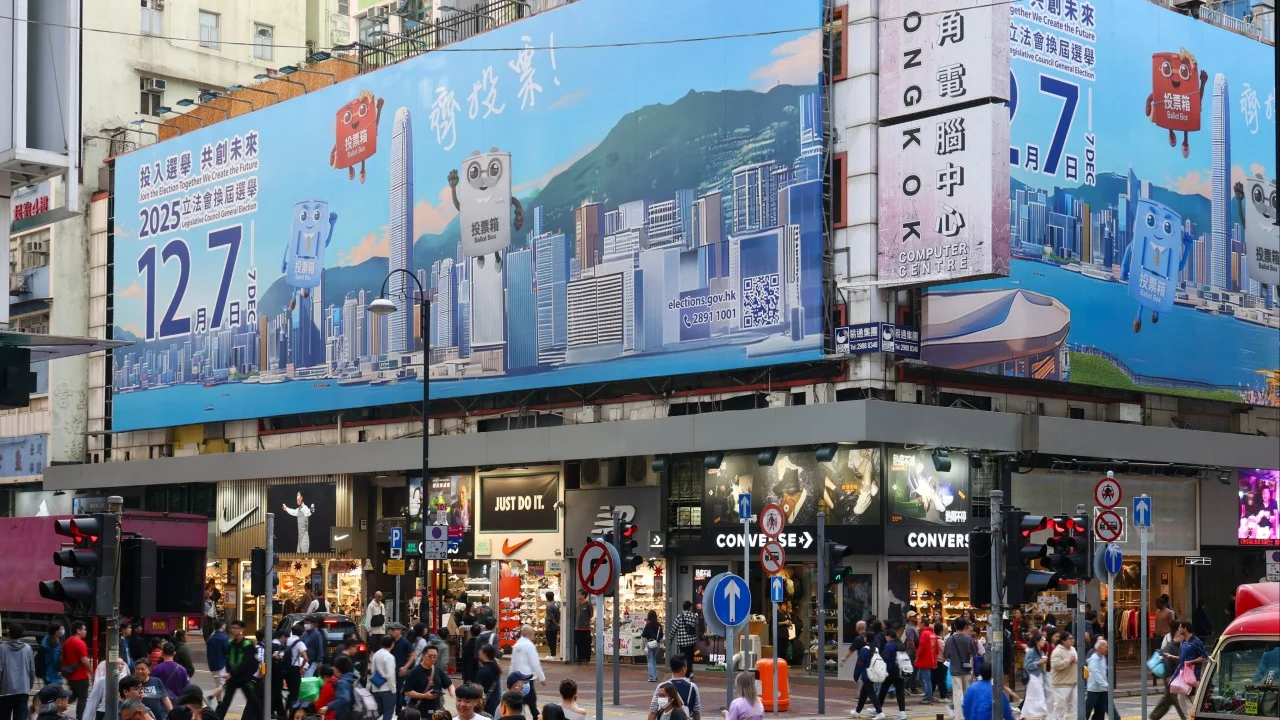 Legco election hopefuls scale back campaigning in Hong Kong fire aftermath