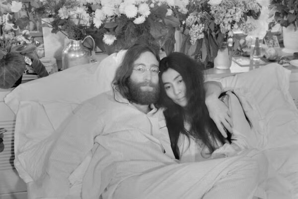 (Original Caption) Yoko and John...Beatle John Lennon and Yoko Ono, his bride of three months at the time this photo was made in Montreal in June 1969, pose in bed. His first solo album at the time featured songs telling of his love for Yoko. They held, in bed, press conferences in several cities with the theme, "make love, not war." Lennon was shot to death December 8, 1980. In a statement December 9th, Miss Ono said, "There is no funeral for John. Later in the week we will set the time for silent vigil to pray for his soul. We invite you to participate from wherever you are at the time."