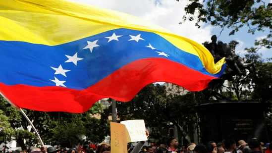 Government supporters participate in a protest against US President Donald Trump's order to blockade sanctioned oil tankers entering and leaving Venezuela, in Caracas, Venezuela.(REUTERS)