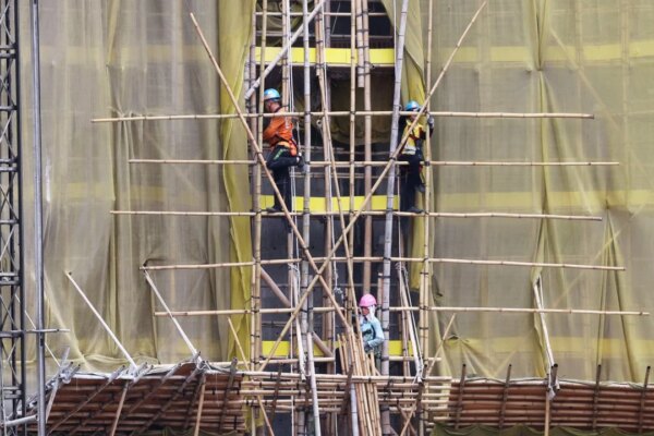 Hong Kong developers push for blanket smoking ban at construction sites after deadly fire