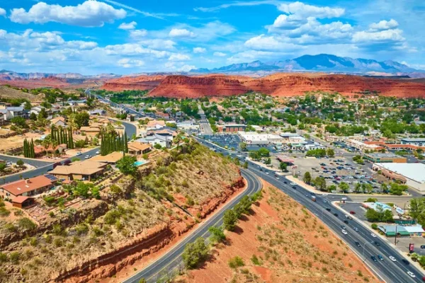 Aerial view of streets in St. George, Utah with red mountains in background