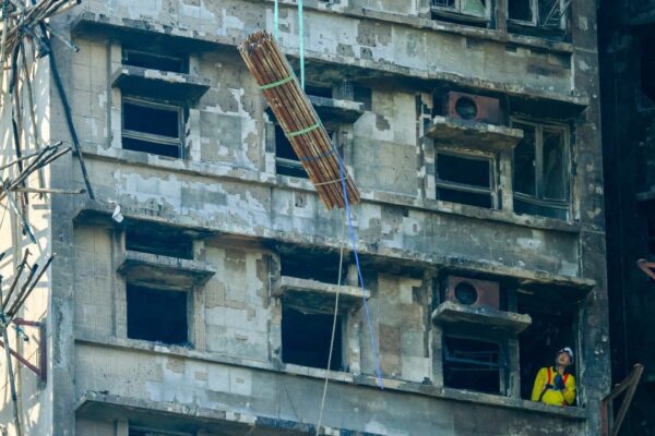 Steel bars brought in to strengthen building ravaged in Hong Kong’s Tai Po blaze