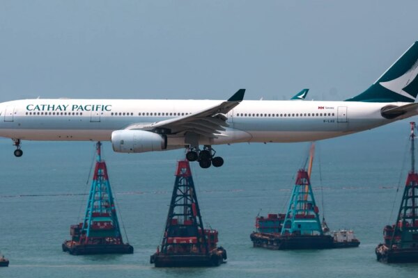 Hong Kong police arrest man over trying to open plane door on Cathay flight