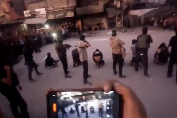 Video shows Hamas armed men dragging seven men into a circle of people in Gaza City, forcing them to their knees and executing them.